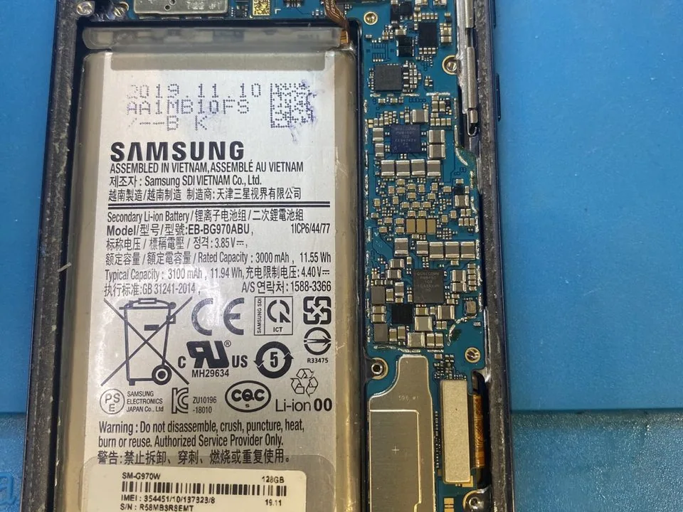 Opened Samsung phone prepared for liquid damage data recovery