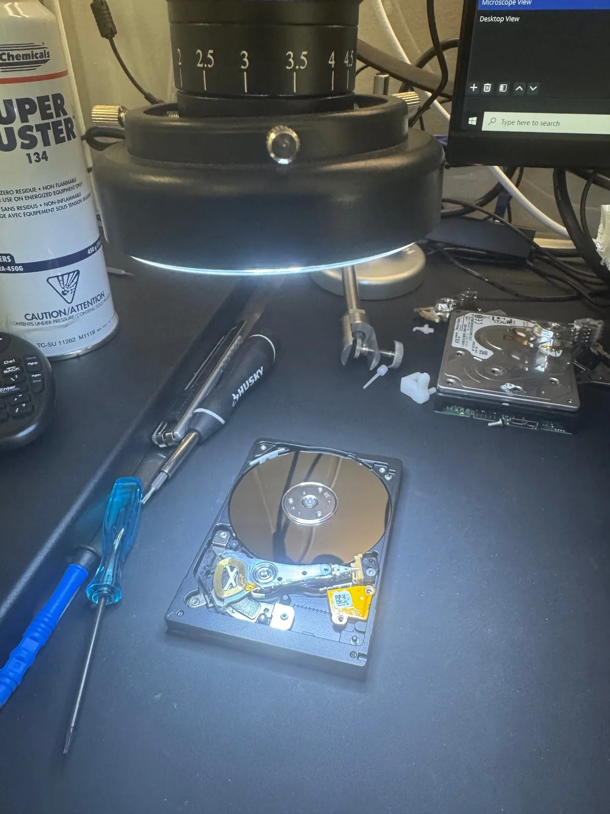 Damaged hard drives prepared for controlled inspection and recovery work