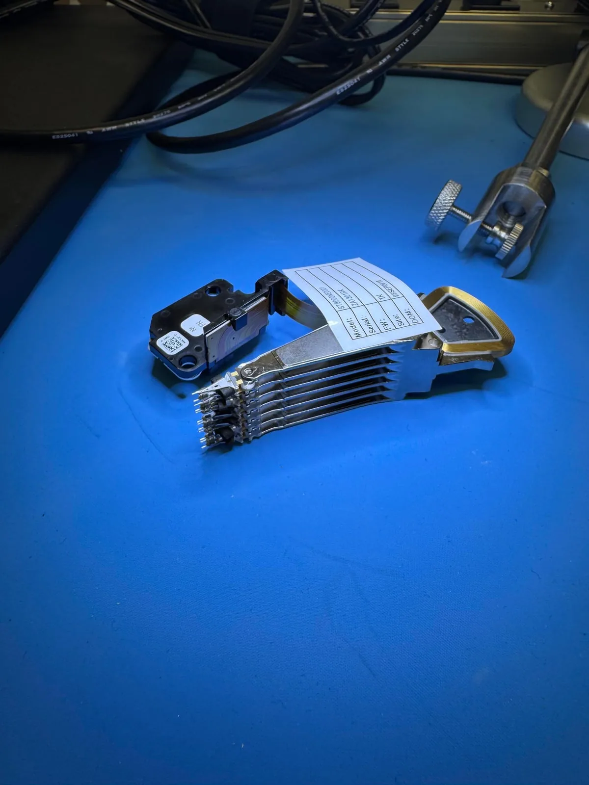 Donor hard drive head assembly prepared for controlled mechanical recovery work