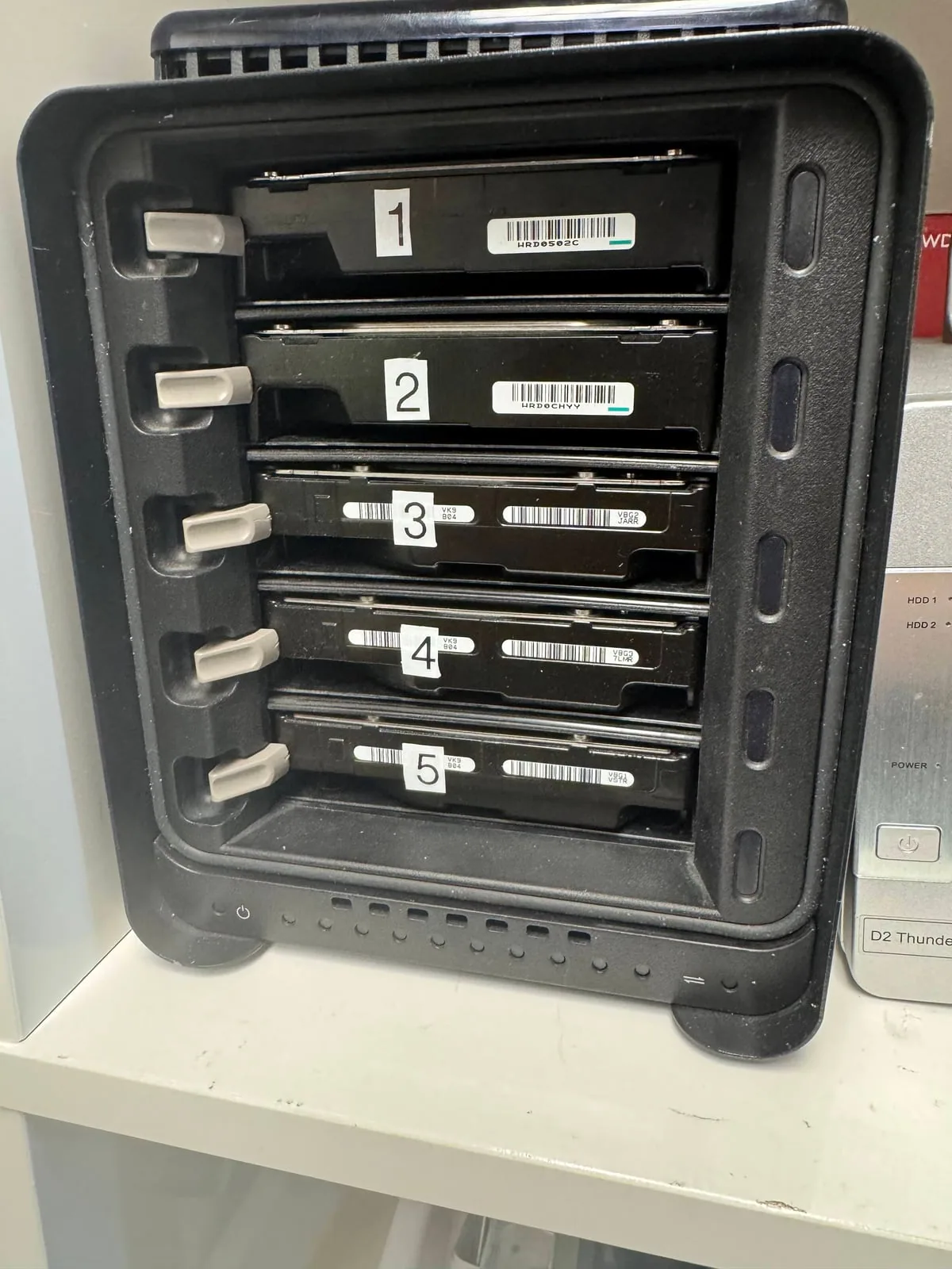 NAS drives numbered to preserve their original bay order before controlled imaging