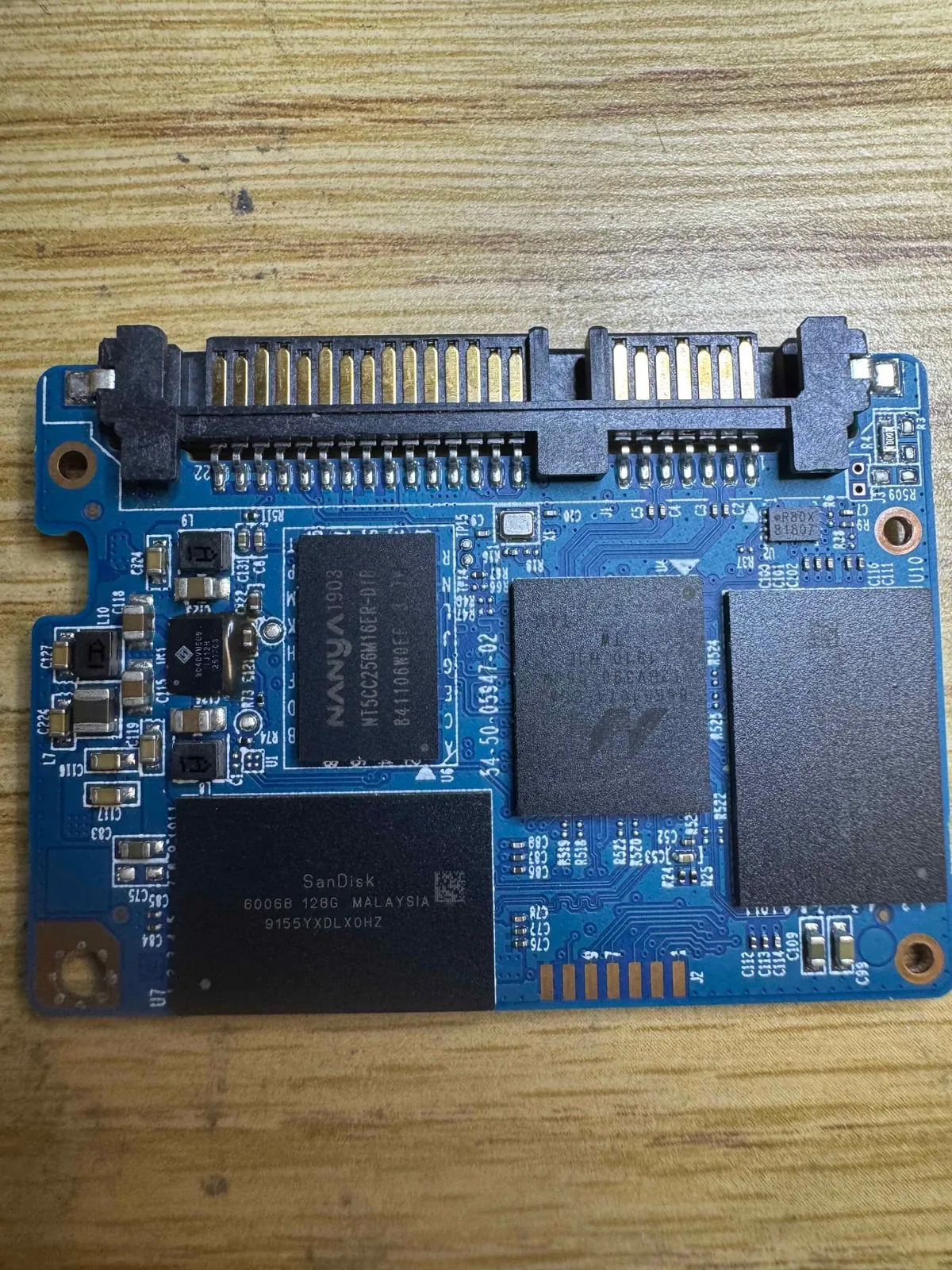 Close-up of an SSD controller and NAND flash memory chips